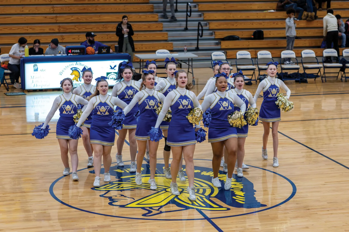 The varsity squad enlivens the crowd during halftime at a home basketball game. Photo: Ron Wade.