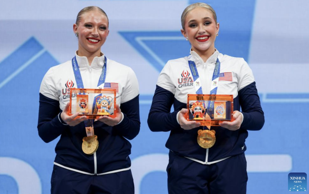 Silver medalists Jennifer Garcia/Fabiana Velez of Ecuador, gold medalists Sydney Martin/Allison Hoeft of the United States and bronze medalists Shayla Myerscough/Emily Growdon of Australia (L to R) pose during the awarding ceremony for the Cheerleading Pom Doubles Final at The World Games 2025 in Chengdu, southwest China's Sichuan Province, Aug. 16, 2025. (Xinhua/Liang Xu)