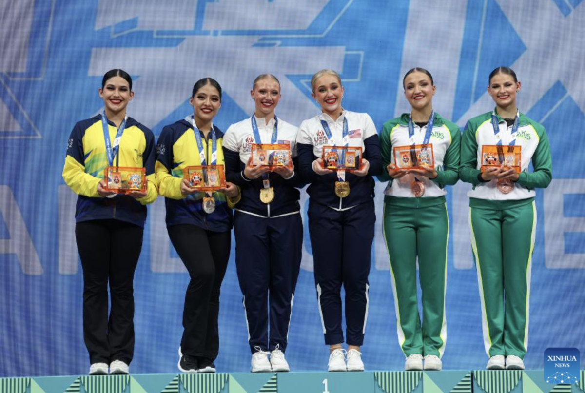 Silver medalists Jennifer Garcia/Fabiana Velez of Ecuador, gold medalists Sydney Martin/Allison Hoeft of the United States and bronze medalists Shayla Myerscough/Emily Growdon of Australia (L to R) pose during the awarding ceremony for the Cheerleading Pom Doubles Final at The World Games 2025 in Chengdu, southwest China's Sichuan Province, Aug. 16, 2025. (Xinhua/Liang Xu)